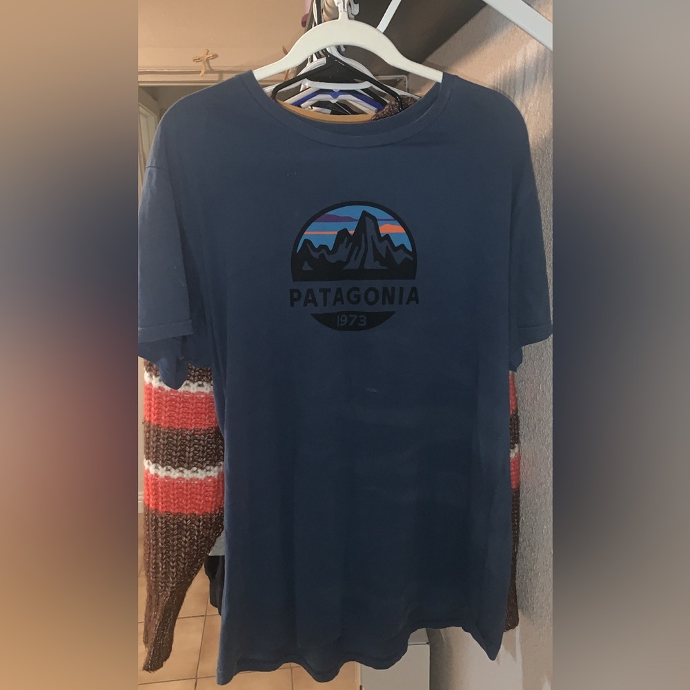 This is a blue Patagonia shirt comes in a size XL . The material is pretty soft